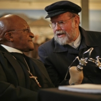 Father Michael Lapsley SSM and the late Archbishop Emeritus Desmond Tutu speak at the book launch for 'Redeeming the Past: My Journey from Freedom Fighter to Healer' at the Homecoming Centre of the District Six Museum on Sept. 3, 2012, in Cape Town. | MARK WESSELS