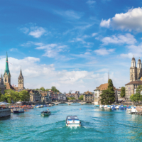 Historical part of Zurich with famous Fraumunster and Grossmunster churches in a beautiful summer day, Switzerland