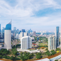 JAKARTA - Indonesia. December 07, 2020: Panoramic view of Jakarta downtown with highrise buildings and housing at morning time