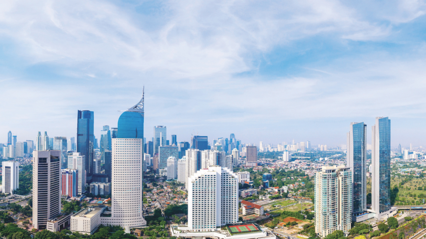JAKARTA - Indonesia. December 07, 2020: Panoramic view of Jakarta downtown with highrise buildings and housing at morning time