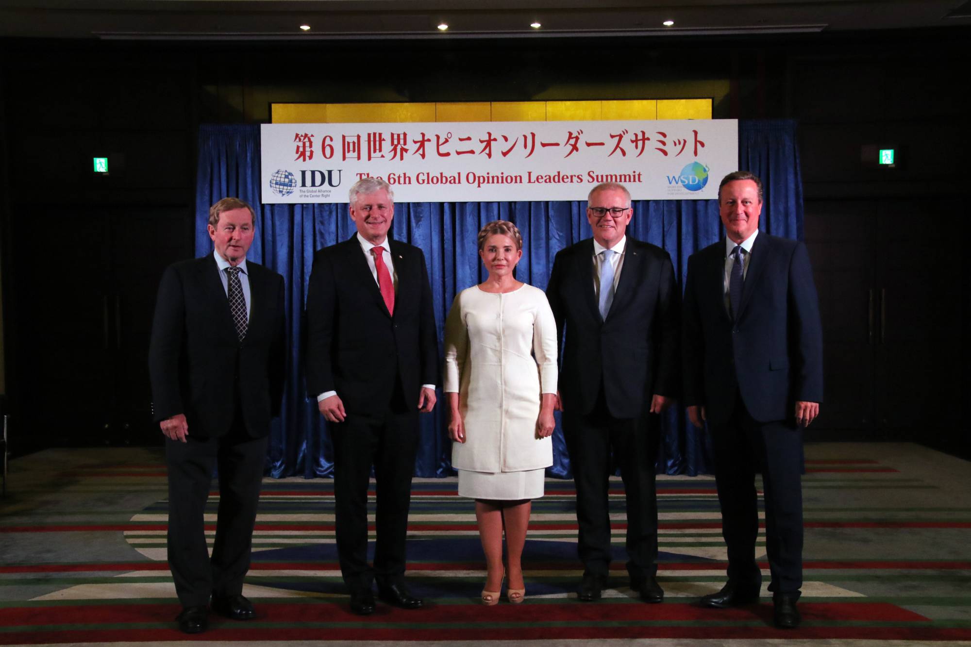 Former Taoiseach of Ireland Enda Kenny (left), former Prime Minister of Canada Stephen Harper (second from left), former Ukraine Prime Minister Yulia Tymoshenko, former Australian Prime Minister Scott Morrison and former Prime Minister of the United Kingdom David Cameron pose at the summit. | TTJ TACHIBANA PUBLISHING