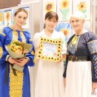 Organizer Nanaha Kinoshita (center) poses with bandura player Kateryna (left) and her mother, Mariya, after the concert.