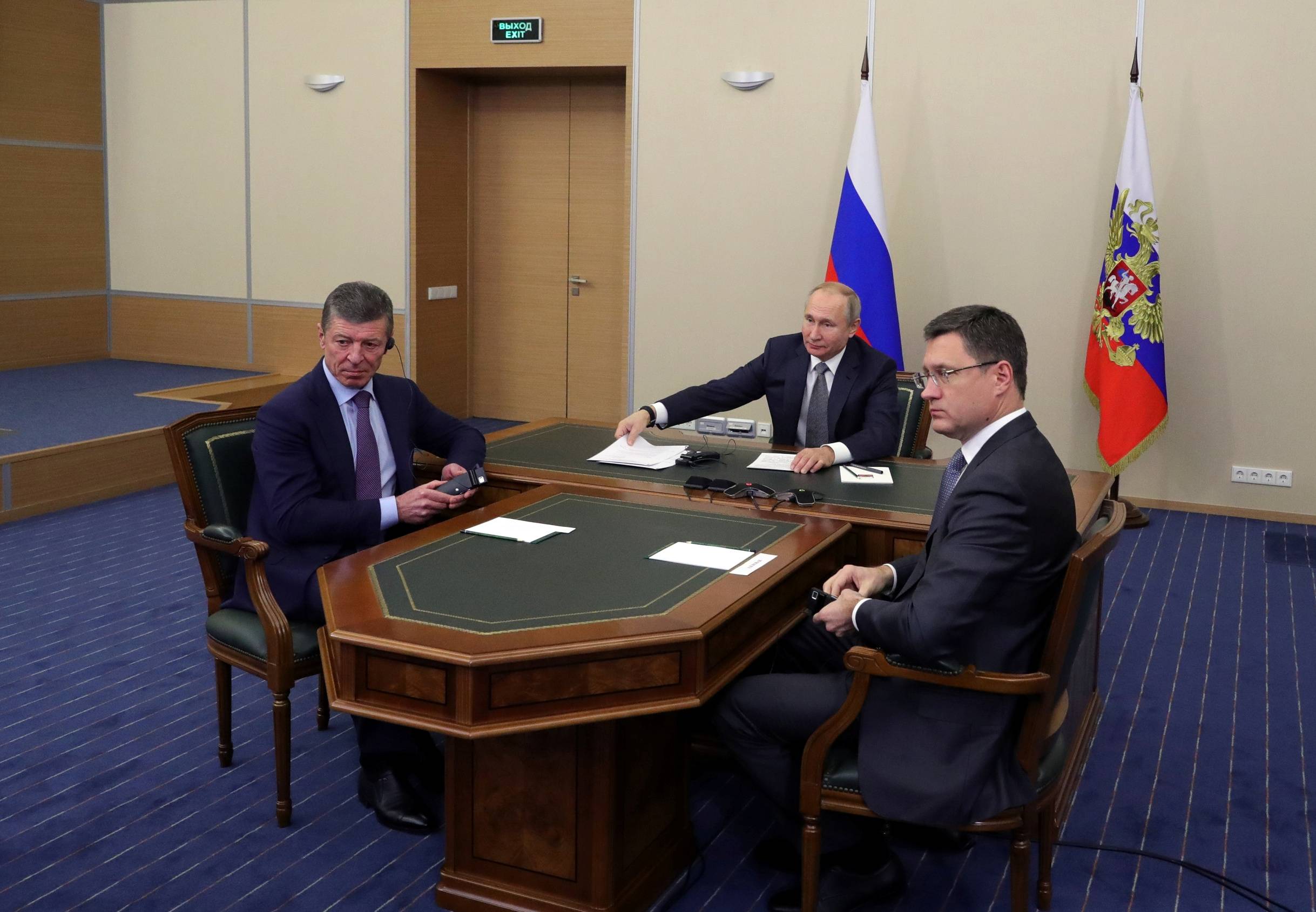 Putin, then-Deputy Prime Minister Dmitry Kozak and then-Energy Minister Alexander Novak take part in a ceremony launching Gazprom's Power of Siberia gas pipeline to China via a video link in Sochi, Russia, in December 2019. | KREMLIN / SPUTNIK / VIA REUTERS