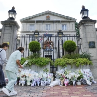 People visit the British Embassy in Tokyo on Sept. 9 to offer flowers after the queen’s death the previous day at the age of 96, following 70 years on the throne. | KYODO