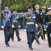 Britain’s King Charles III (center), Prince William (far left), Prince Harry (third from right) and Princess Anne (far right) walk behind the coffin of Queen Elizabeth II during a procession from Buckingham Palace to Westminster Hall in London on Wednesday. | KYODO