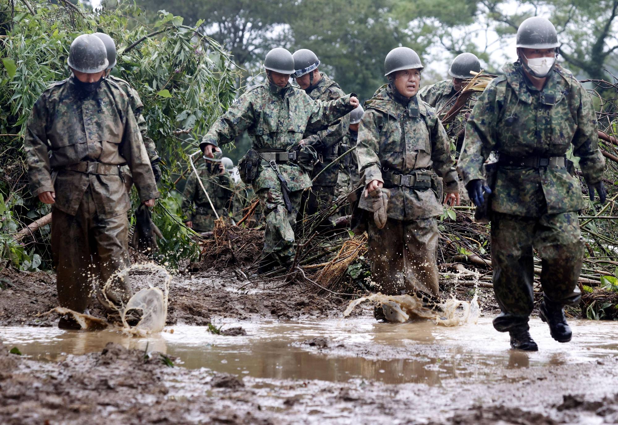 Ground Self-Defense Forces personnel search the site of a landslide in Mimata, Miyazaki Prefecture on Monday | KYODO