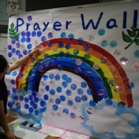 A prayer wall is decorated with many prayers, such as those for world peace, written by students, faculty and staff members.   | AOYAMA GAKUIN SCHOOL CORP.

