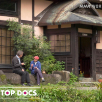 The Bengs speak in front of their home in Niigata.