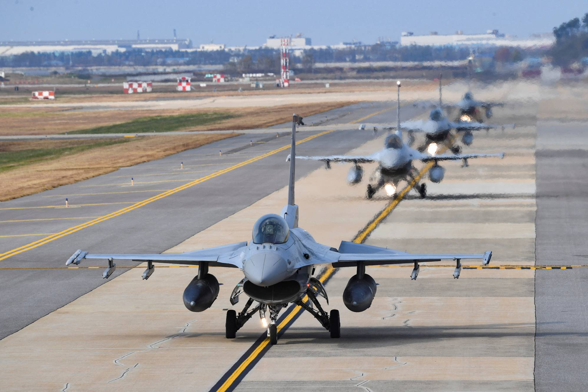 South Korean Air Force KF-16 fighter jets take part in the Vigilant Storm joint South Korean-U.S. air drills at an airbase in Gunsan, South Korea, on Tuesday. | YONHAP / VIA REUTERS 