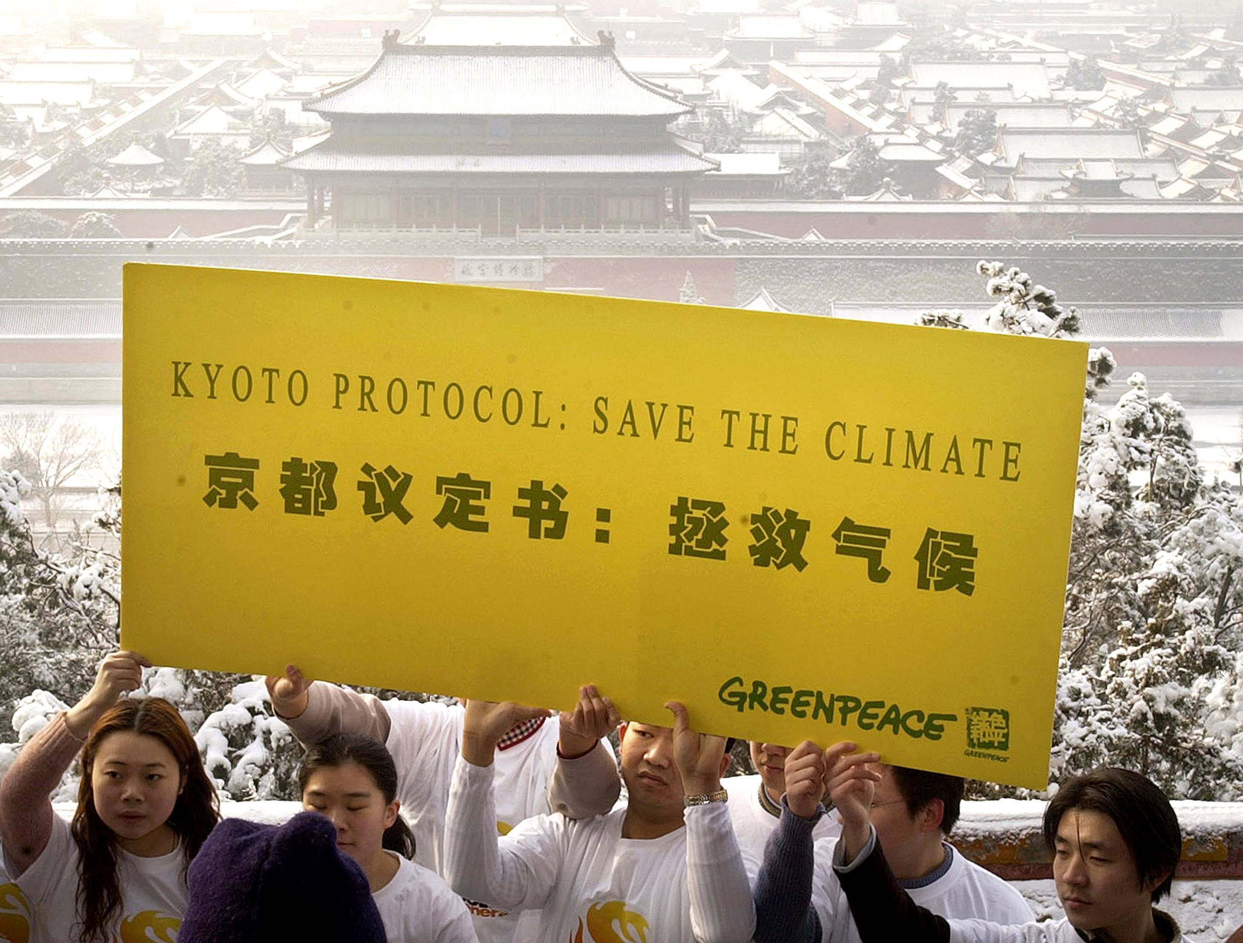 Chinese students promote the Kyoto Protocol in Beijing on Feb. 16, 2005, the day the agreement went into effect. | CHINA NEWSPHOTO / VIA REUTERS