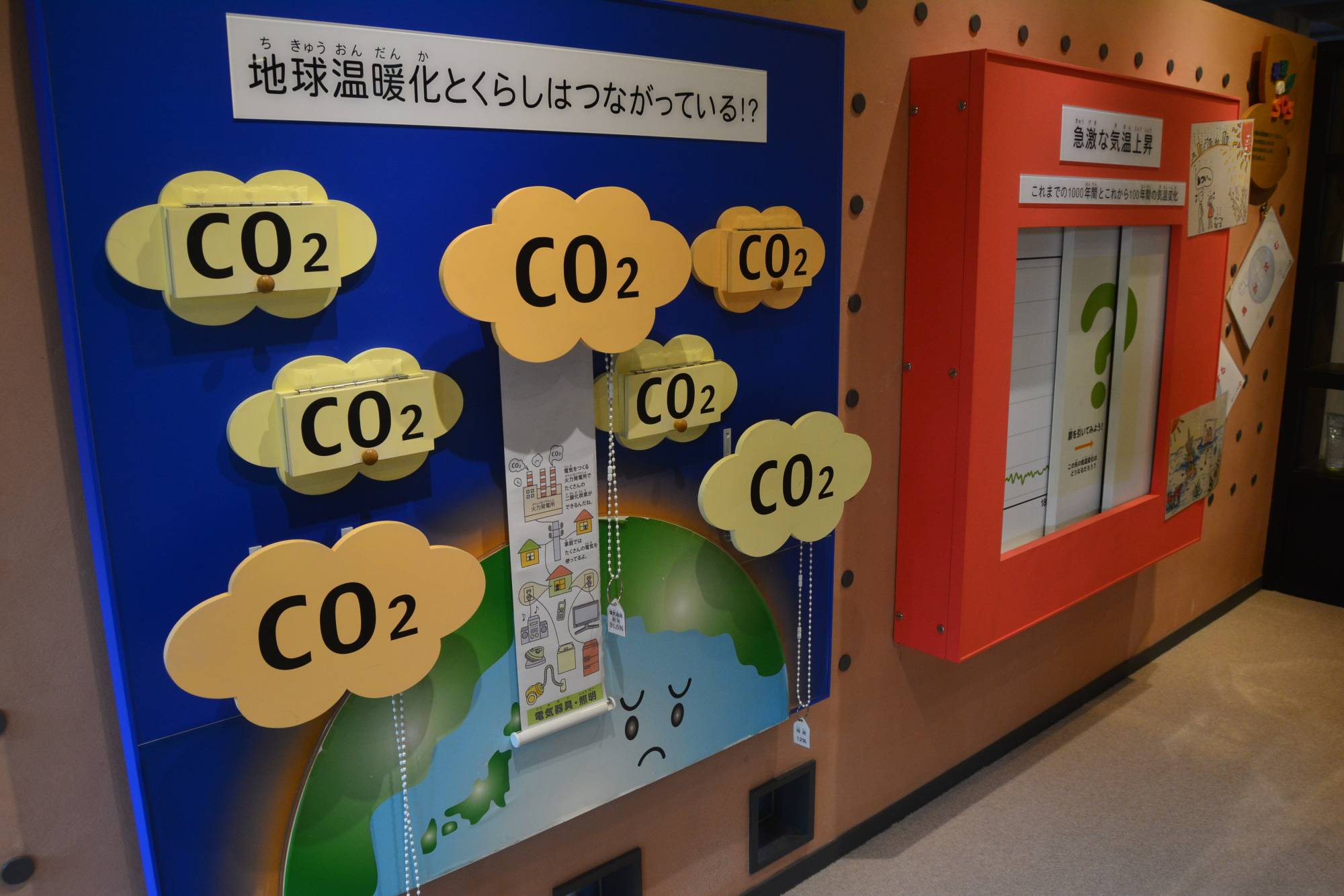 A display about the connection between global warming and life on Earth at the Miyako Ecology Center | JOEL TANSEY 