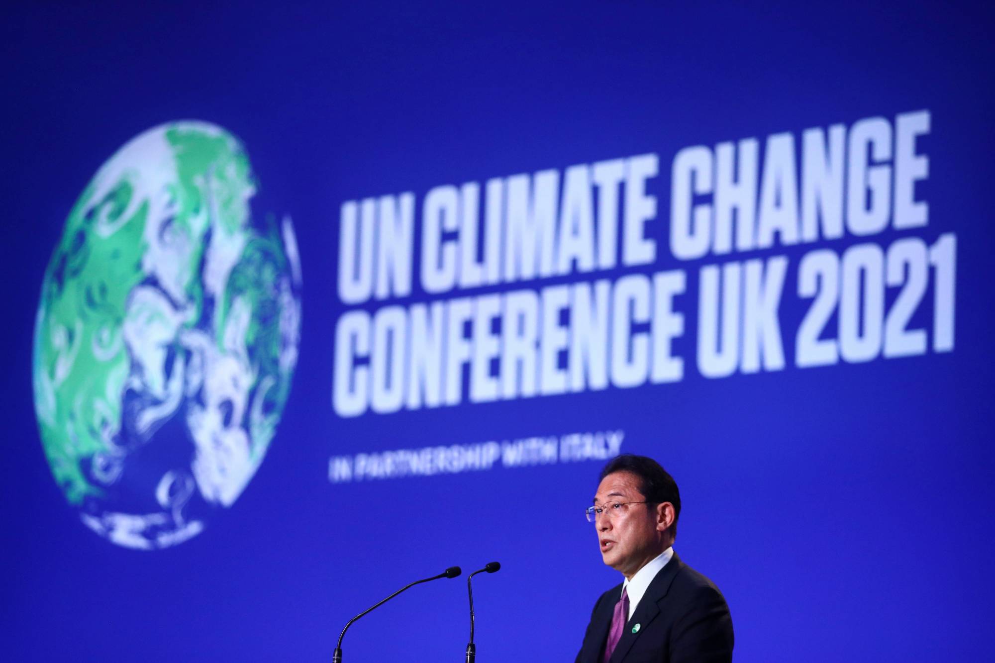 Prime Minister Fumio Kishida speaks during the COP26 climate summit in Glasgow, Scotland, in November 2021. | REUTERS 