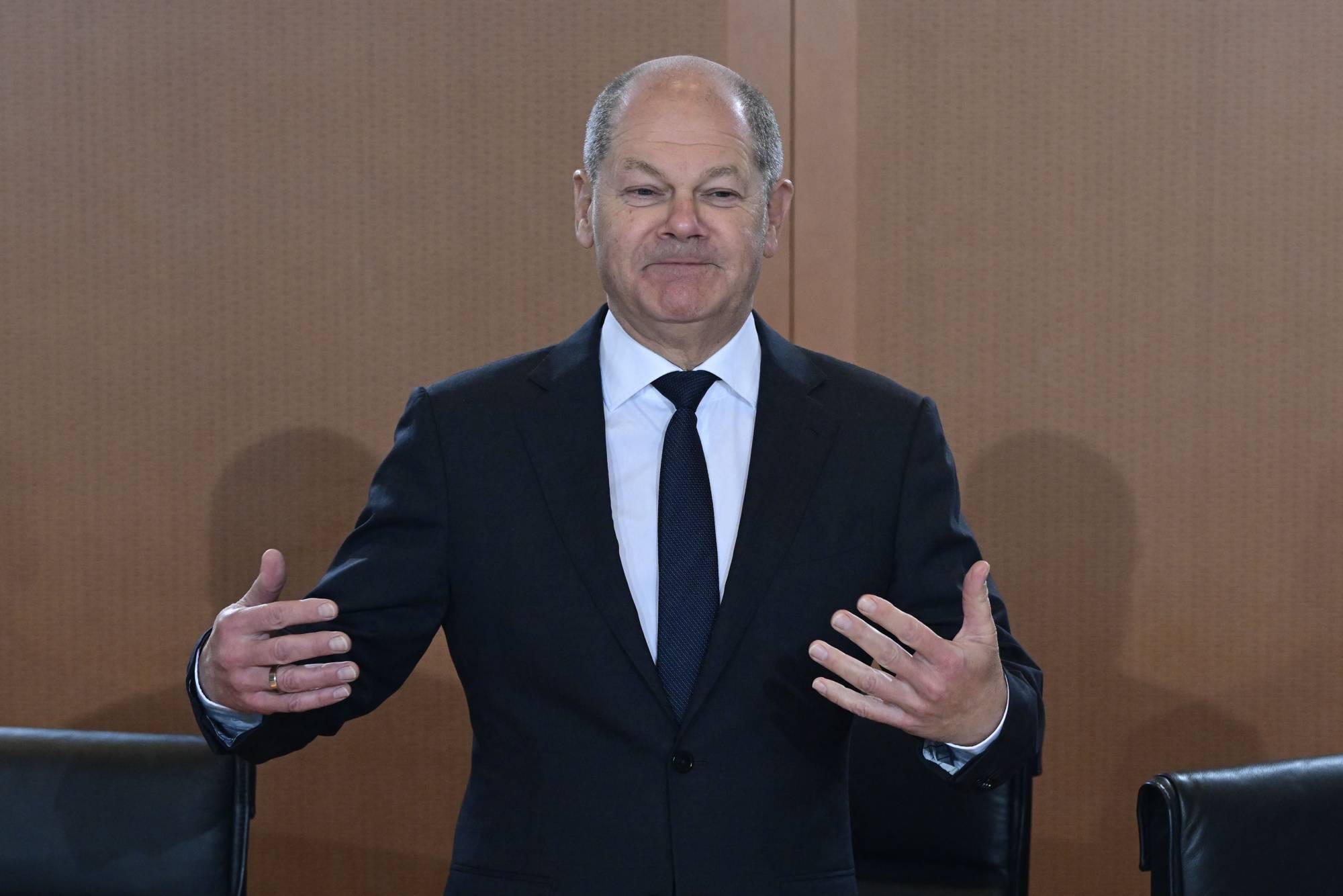 German Chancellor Olaf Scholz speaks to Cabinet members in Berlin on Dec. 7. Germany aims move away from coal use by 2038, but the current government is pushing for an even earlier target of 2030. | AFP-JIJI