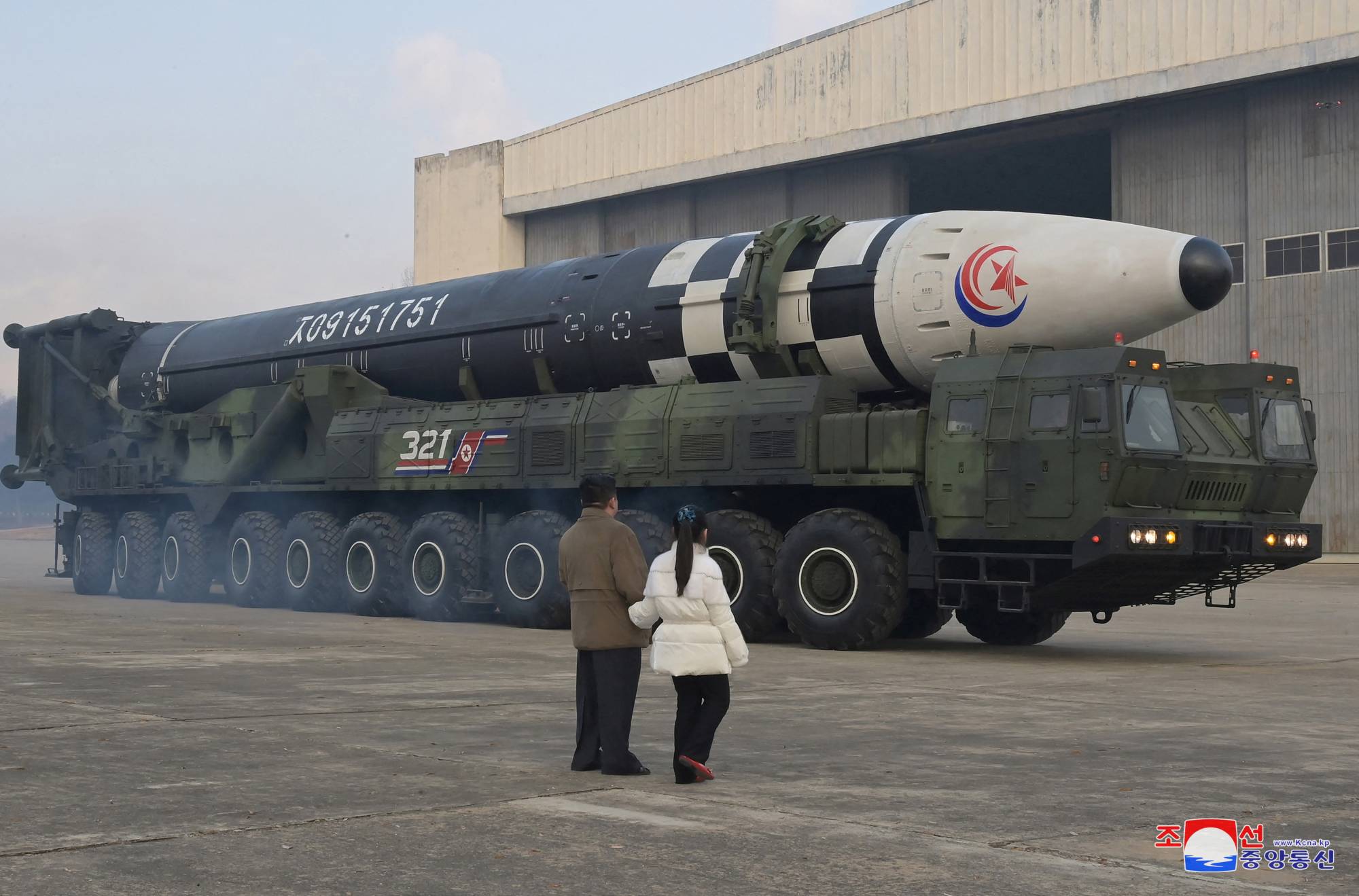North Korean leader Kim Jong Un, along with his daughter, inspects an intercontinental ballistic missile in an undated photo released on Nov. 19. | KCNA / VIA REUTERS 