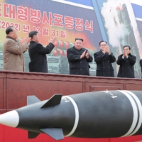 North Korean leader Kim Jong Un attends a ceremony where the new superlarge multiple rocker launchers were presented before a plenary meeting of the ruling Workers\' Party of Korea in Pyongyang on Jan. 1. | KCNA / VIA REUTERS   