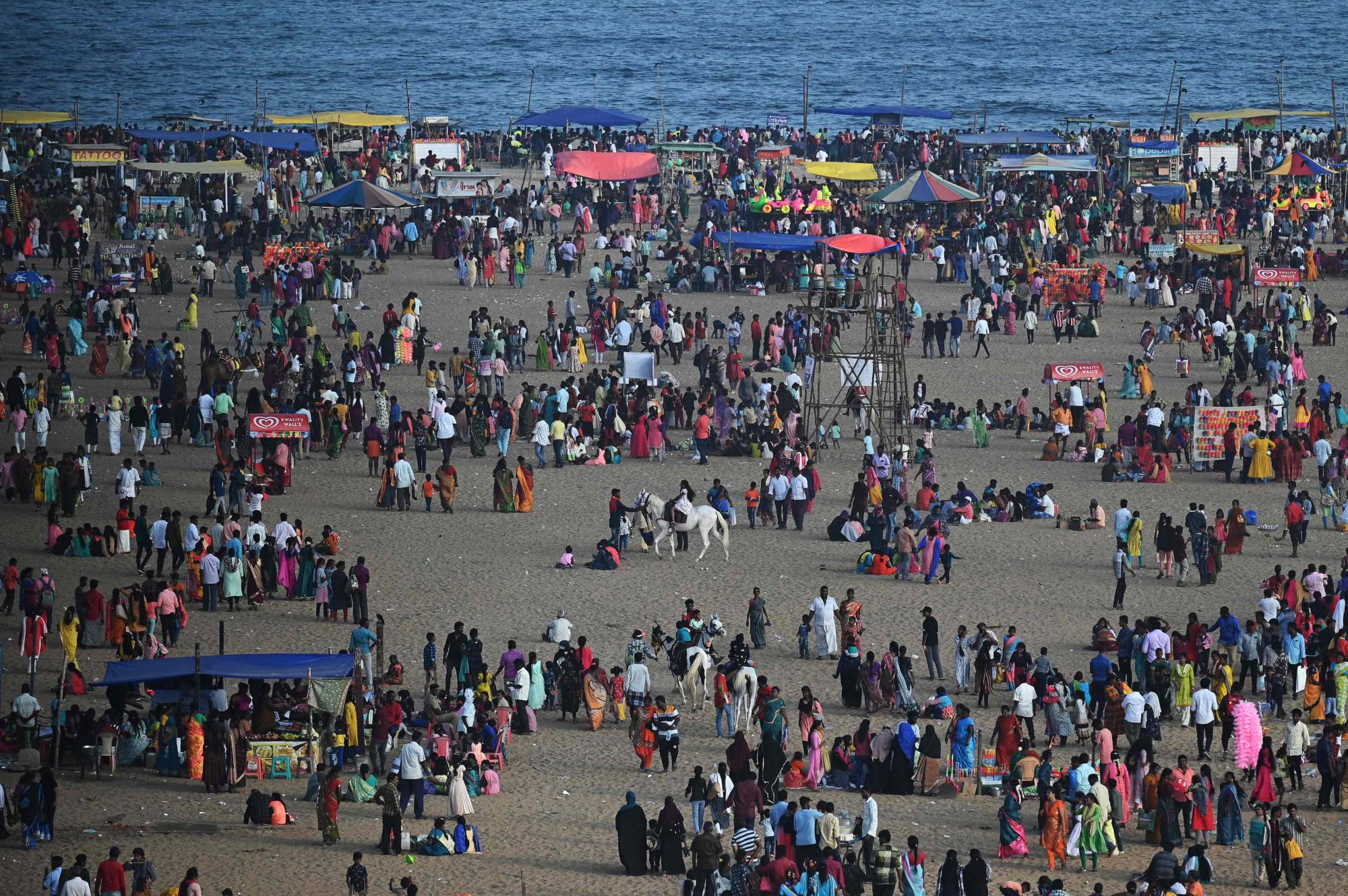 People gather at Marina beach on the occasion of the Hindu harvest festival of 'Pongal' in Chennai, India, on Tuesday. | AFP-JIJI