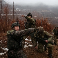 U.S. Army soldiers and South Korean soldiers take part in a joint military exercise near the demilitarized zone separating the two Koreas in Paju, South Korea, on Friday. | REUTERS