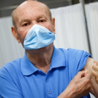 A man receives a COVID-19 vaccine booster shot in Seville, Spain, in 2021
 | REUTERS 