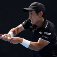 Yoshihito Nishioka hits a return against Czech Republic\'s Dalibor Svrcina during their match on day three of the Australian Open tennis tournament in Melbourne on Wednesday. | AFP-JIJI