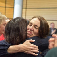 New Zealand Prime Minister Jacinda Ardern hugs a supporter on Thursday in the city of Napier following the announcement of her decision to step down. |  AAP IMAGE / VIA REUTERS  
