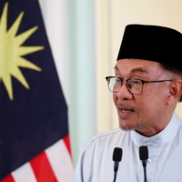 Malaysian Prime Minister Anwar Ibrahim speaks during a news conference in Putrajaya on Dec. 2.  | REUTERS