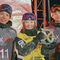 Women\'s halfpipe winner Mitsuki Ono (center), men\'s halfpipe winner Ruka Hirano (left) and men\'s third-place finisher Yuto Totsuka pose after the victory ceremony of a snowboarding World Cup event in Laax, Switzerland, on Saturday. | KYODO