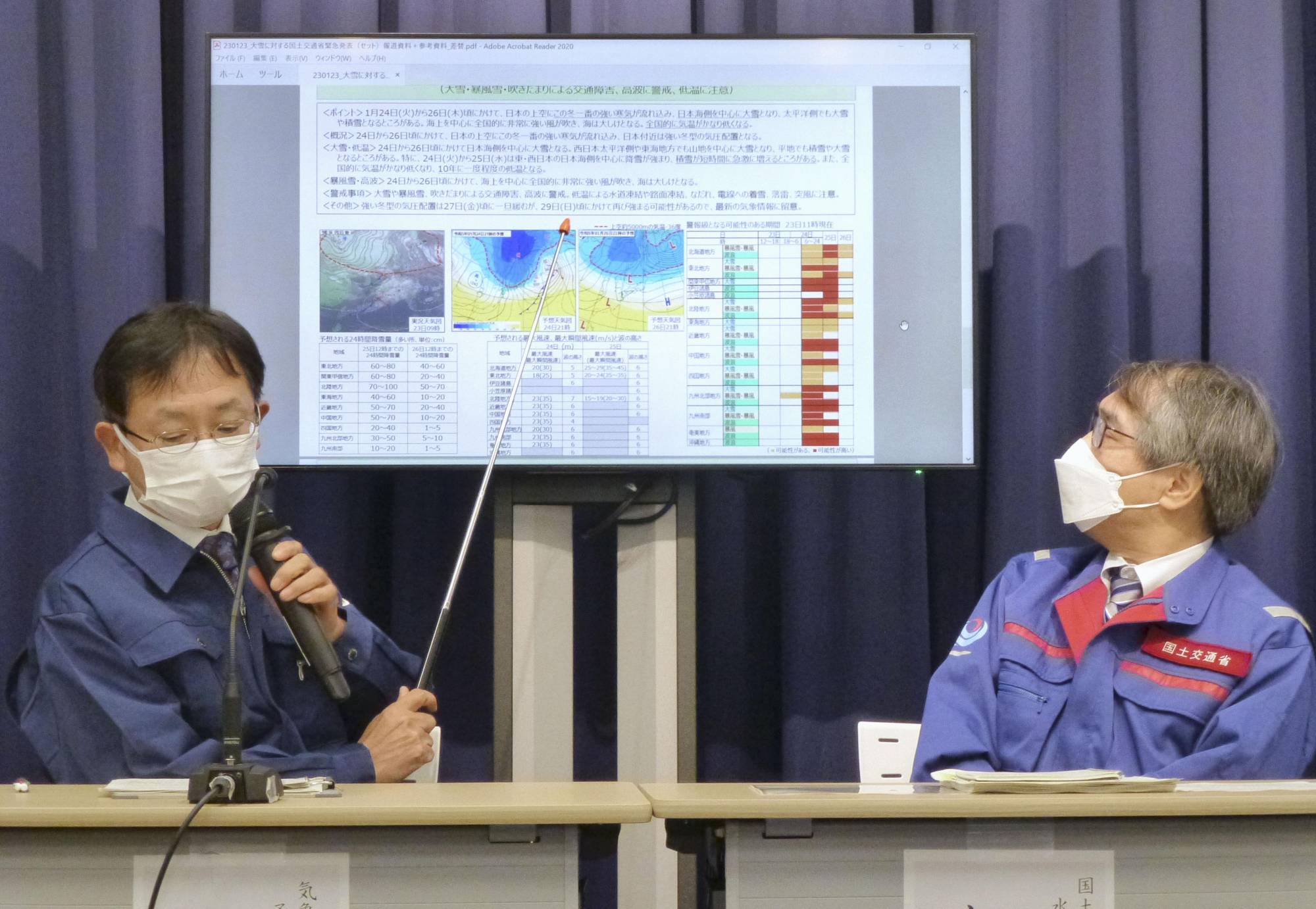 Officials from the Meteorological Agency and the Ministry of Land, Infrastructure, Transport and Tourism speak at a news conference on Monday about the impacts of a winter storm. | KYODO 