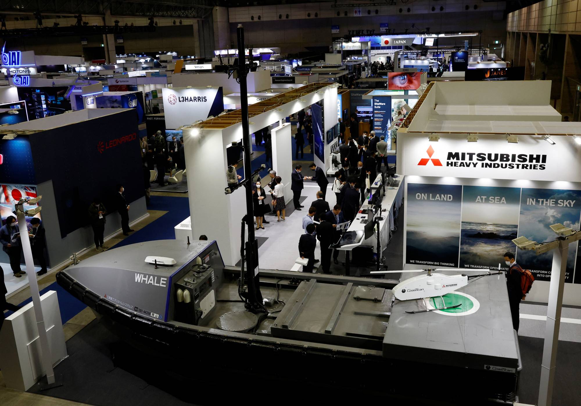 Mitsubishi Heavy Industries' unmanned surface vehicle is displayed at the DSEI Japan defense show at Makuhari Messe in Chiba on March 15. | REUTERS U.S. AMBASSADOR TO JAPAN RAHM EMANUEL VISITS THE DSEI JAPAN DEFENSE SHOW AT MAKUHARI MESSE IN CHIBA