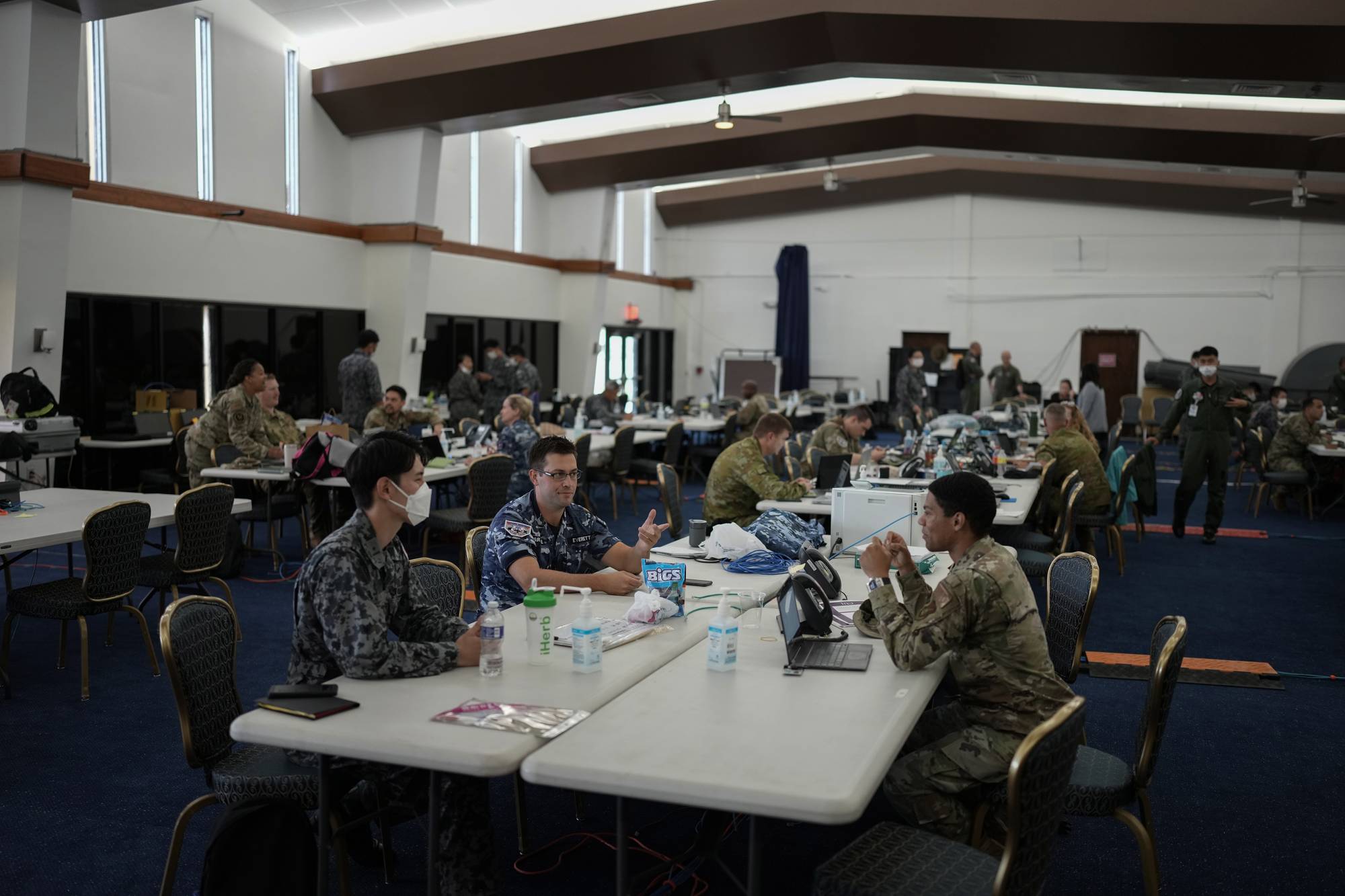 U.S., Australian and Japanese military teams collaborate during a joint drill at Andersen Air Force Base on Guam on Feb. 17. | CHANG W. LEE / THE NEW YORK TIMES