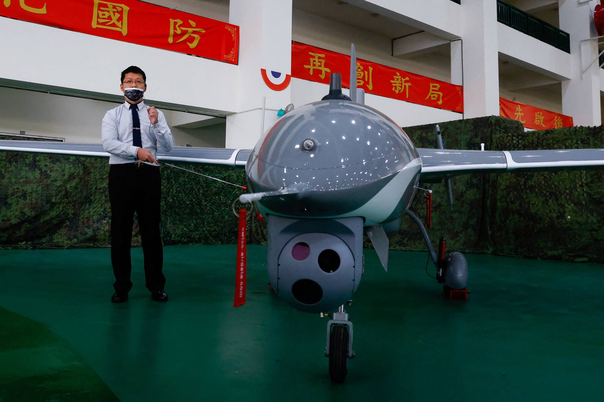 A domestically developed Albatross II unmanned aerial vehicle is displayed at a Taiwanese Defense Ministry media showcase of its drones in Taichung, Taiwan, on March 14. | REUTERS