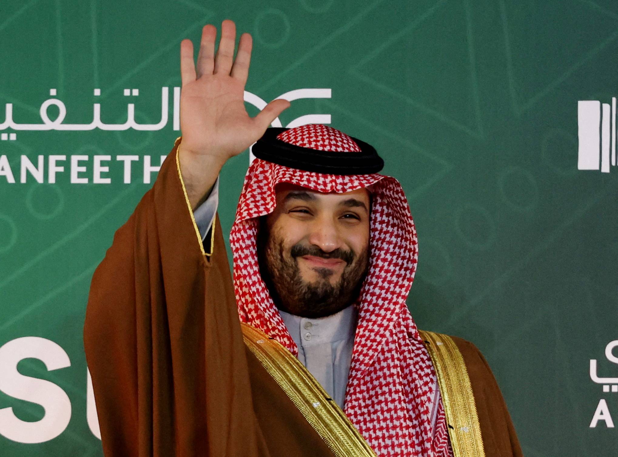 Saudi crown prince Mohammed bin Salman waves during a horse-racing trophy ceremony in Riyadh on Feb. 25. | REUTERS