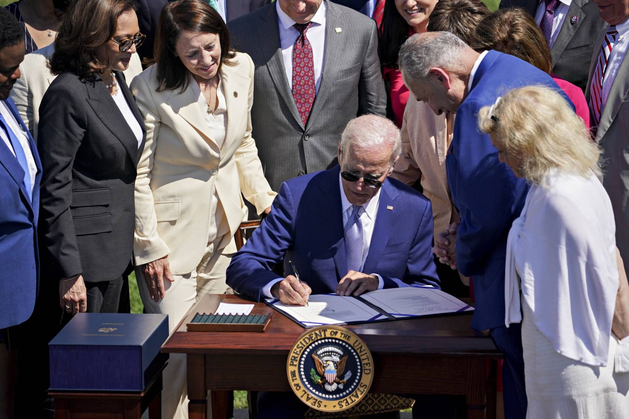 U.S. President Joe Biden signs the Chips and Science Act of 2022, during a ceremony at the White House in Washington on Aug. 9. | BLOOMBERG U.S. President Joe Biden signs the Chips and Science Act of 2022, during a ceremony at the White House in Washington on Aug. 9. | BLOOMBERG