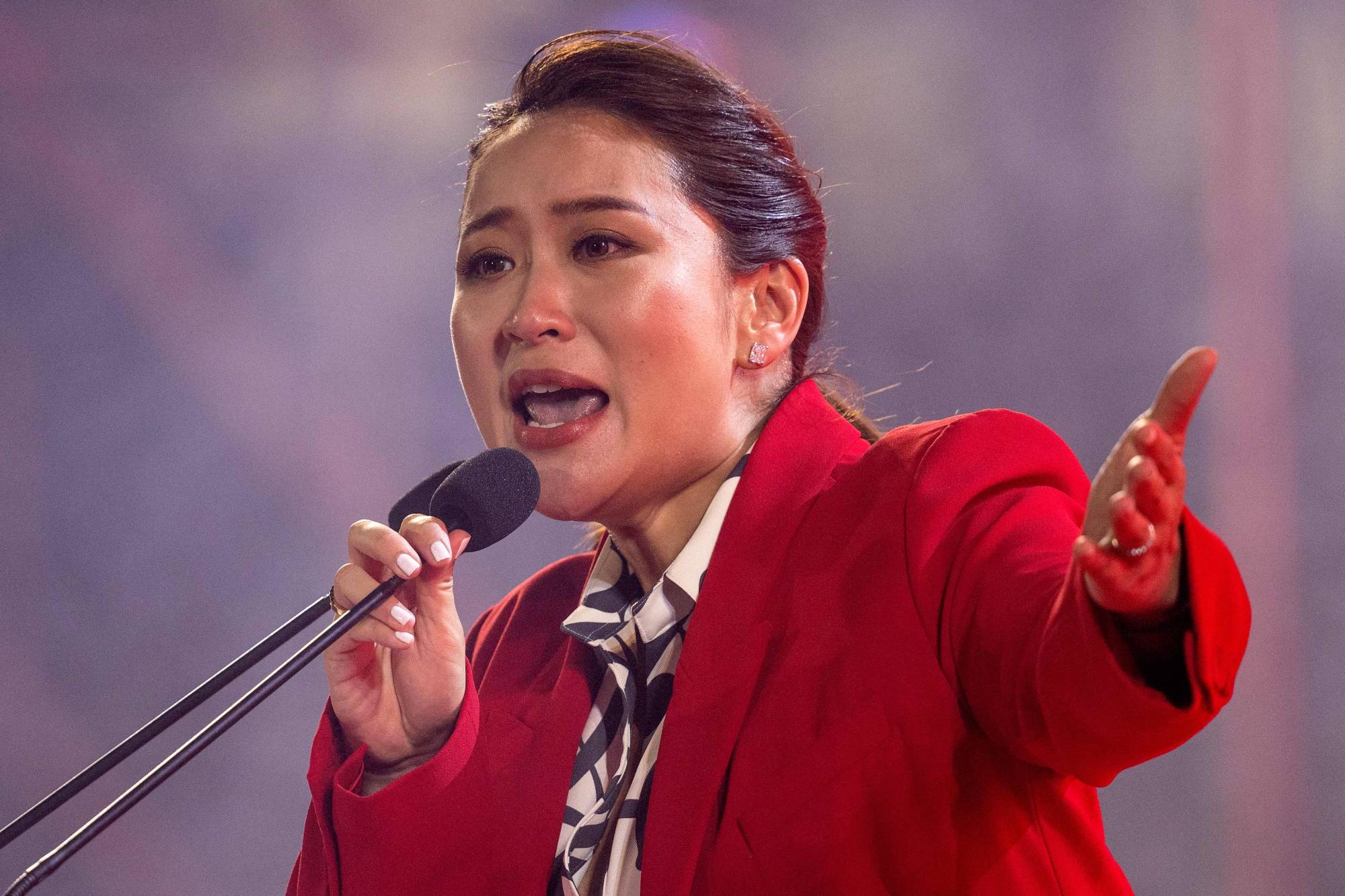 Thai candidate for prime minister, Paetongtarn Shinawatra, speaks on stage during an election rally for the main opposition Pheu Thai party in Nonthaburi on April 5. | AFP-JIJI