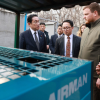 Prime Minister Fumio Kishida inspects power generators provided by the Japanese government during his visit to Bucha, Ukraine, on March 21. | CABINET PUBLIC AFFAIRS OFFICE