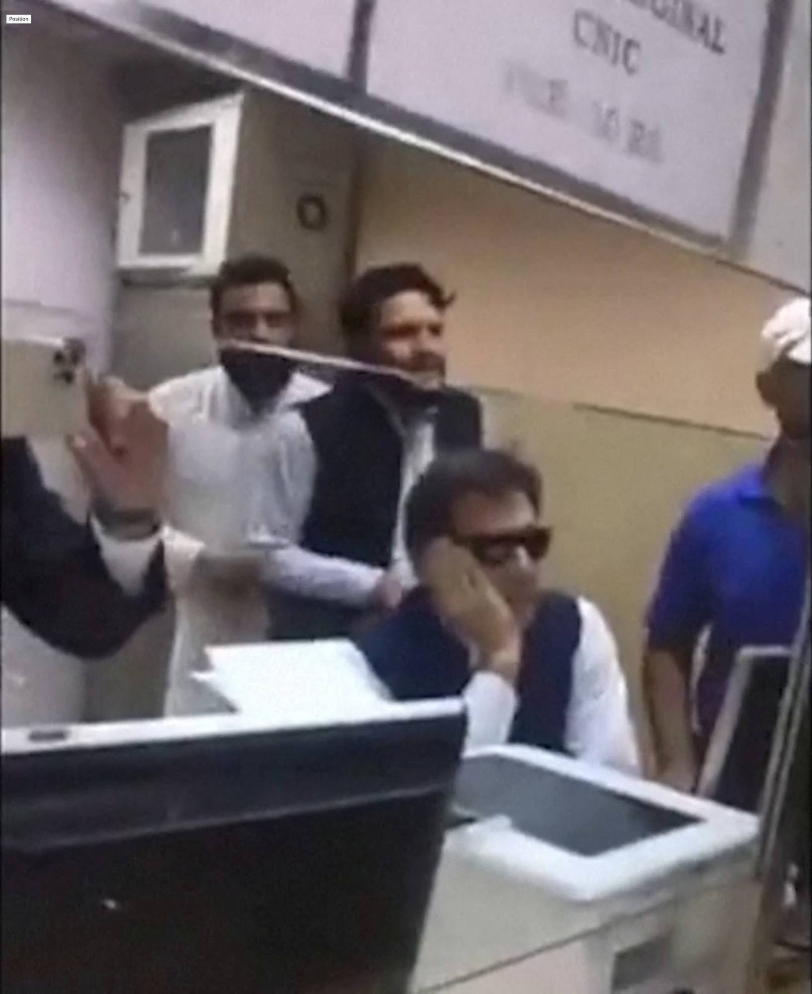Khan seated in court as security enters to arrest him in Islamabad on Tuesday | PAKISTAN TEHREEK-E-INSAF / VIA REUTERS 