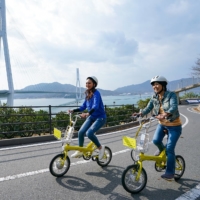 A popular way to see the sights is through the 70-km Shimanami Kaido cycling course.