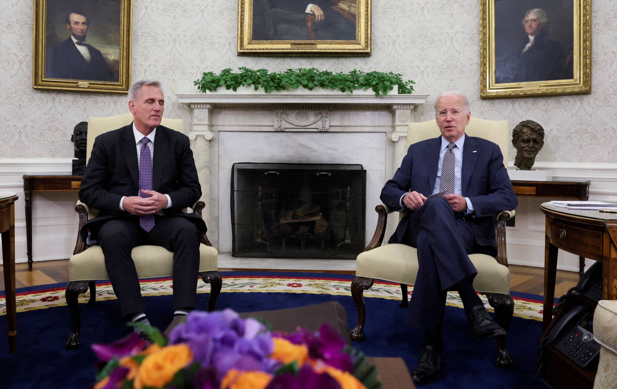 U.S. House Speaker Kevin McCarthy and U.S. President Joe Biden sit for talks on the debt ceiling at the White House in Washington on May 22. | REUTERS