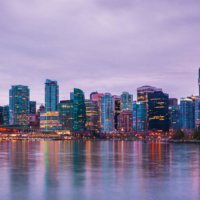 Vancouver skyline at sunset as seen from Stanley Park, British Columbia, Canada