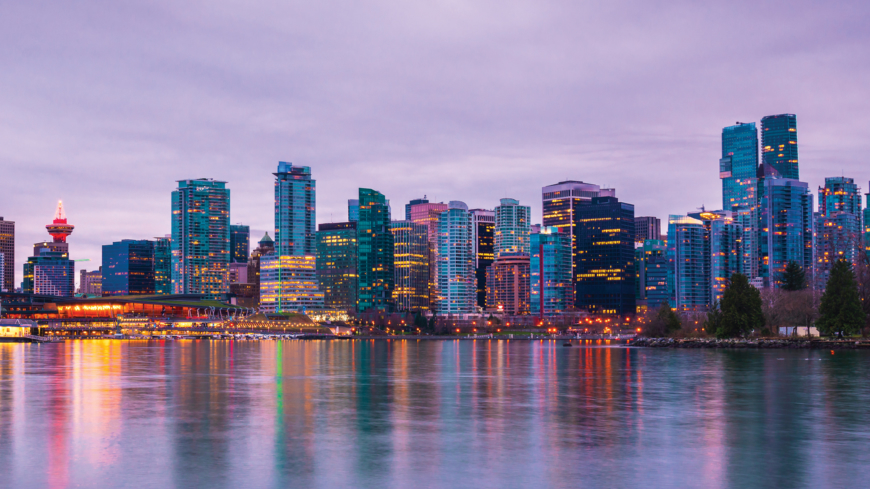 Vancouver skyline at sunset as seen from Stanley Park, British Columbia, Canada