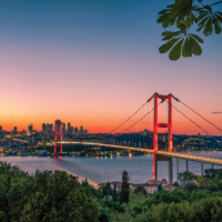 Istanbul sunset from most famous and touristic destination Nation Park in Nakkastepe. 15th July Martyrs Bridge (15 Temmuz Sehitler Koprusu). Istanbul Bosphorus Bridge Romantic landscape Istanbul City.