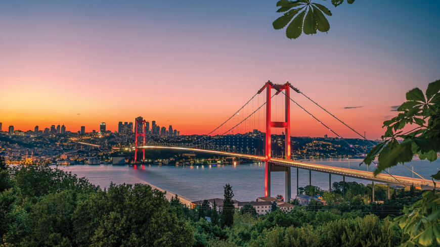 Istanbul sunset from most famous and touristic destination Nation Park in Nakkastepe. 15th July Martyrs Bridge (15 Temmuz Sehitler Koprusu). Istanbul Bosphorus Bridge Romantic landscape Istanbul City.