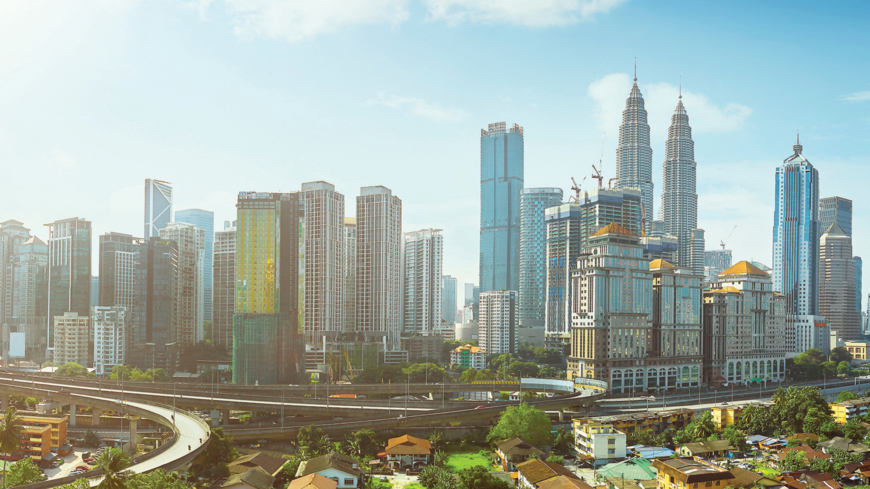 Open space balcony with Kuala Lumpur cityscape skyline view.