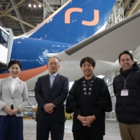 Pictured from left: Kuwahara town Mayor of Tsunan, Hideki Mineguchi - President of AirJapan, and representatives from Tsunan Sake Brewery, Kengo Suzuki and Atsushi Kabasawa.