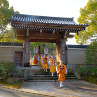 Agon Shu faithful dressed as yamabushi (mountain priests) wend their way toward the organization’s amphitheater.