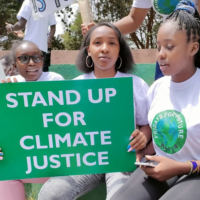 Kenyan environmental activist Elizabeth Wathuti (center) joins the Global Climate Strike in Nairobi in September 2021.