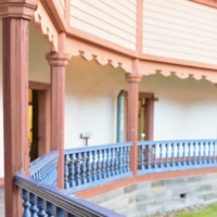 The fence, painted in vivid blue, was crafted by artisans specializing in traditional craftsmanship.