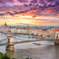 Budapest city evening scene. View at Chain bridge, river Danube and famous building of Parliament. Location: Budapest, Hungary, Europe.