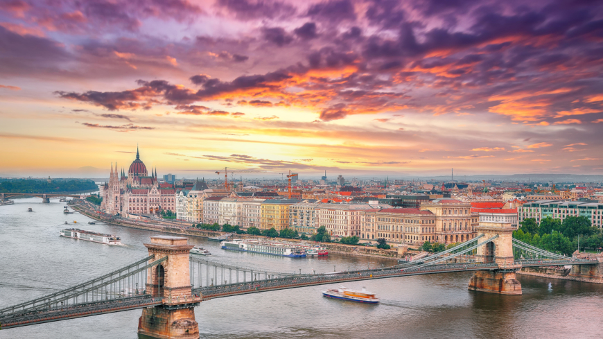 Budapest city evening scene. View at Chain bridge, river Danube and famous building of Parliament. Location: Budapest, Hungary, Europe.