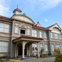 A stunning European-style wooden building seamlessly blends traditional craftsmanship with elegant Renaissance design elements.