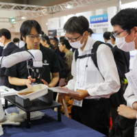 Attendees listen as a vendor speaks about his company’s products at the 2024 show.
